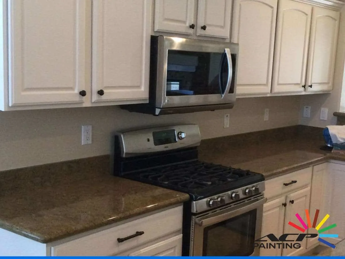 White Cabinets and Trim Yellow in Arizona Homes showing kitchen cabinetry.