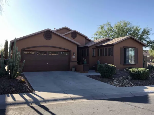 Single-story East Valley stucco house with a brown garage door after an exterior repaint by ACP Painting