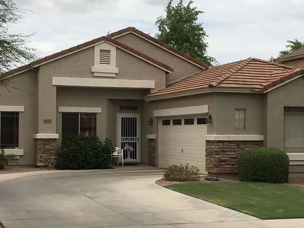 Freshly repainted stucco home exterior with tile roof in Maricopa, AZ