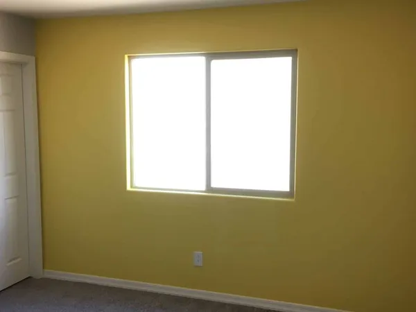 Painted interior wall shown under natural window light in an Arizona home