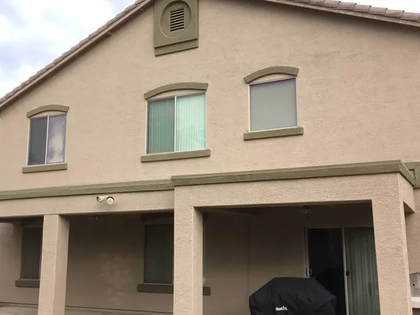 Two-story stucco home exterior repainted by ACP Painting in Phoenix, AZ