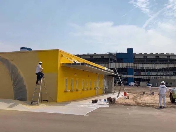 ACP Painting crew repainting a commercial building exterior in the Phoenix metro