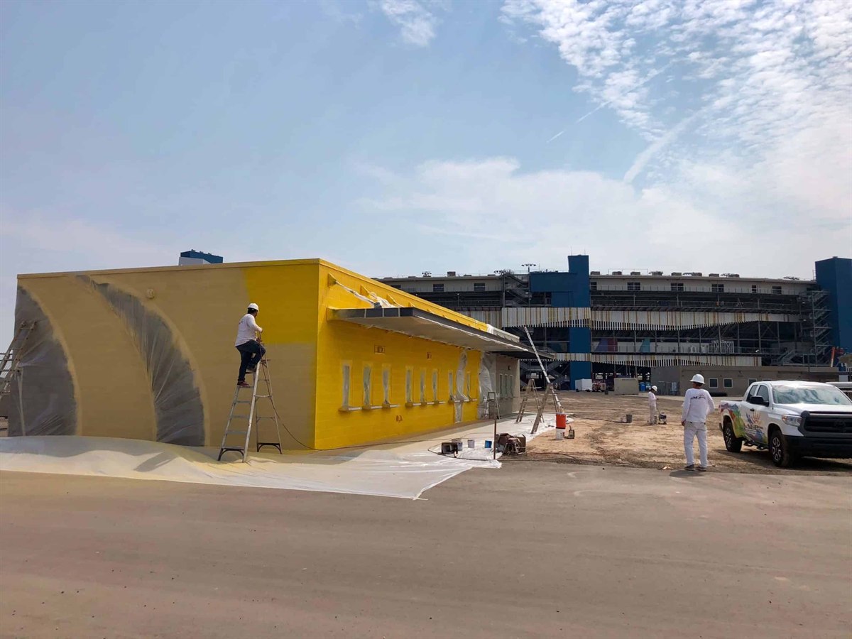 ACP Painting crew working on a commercial building exterior in the Phoenix metro