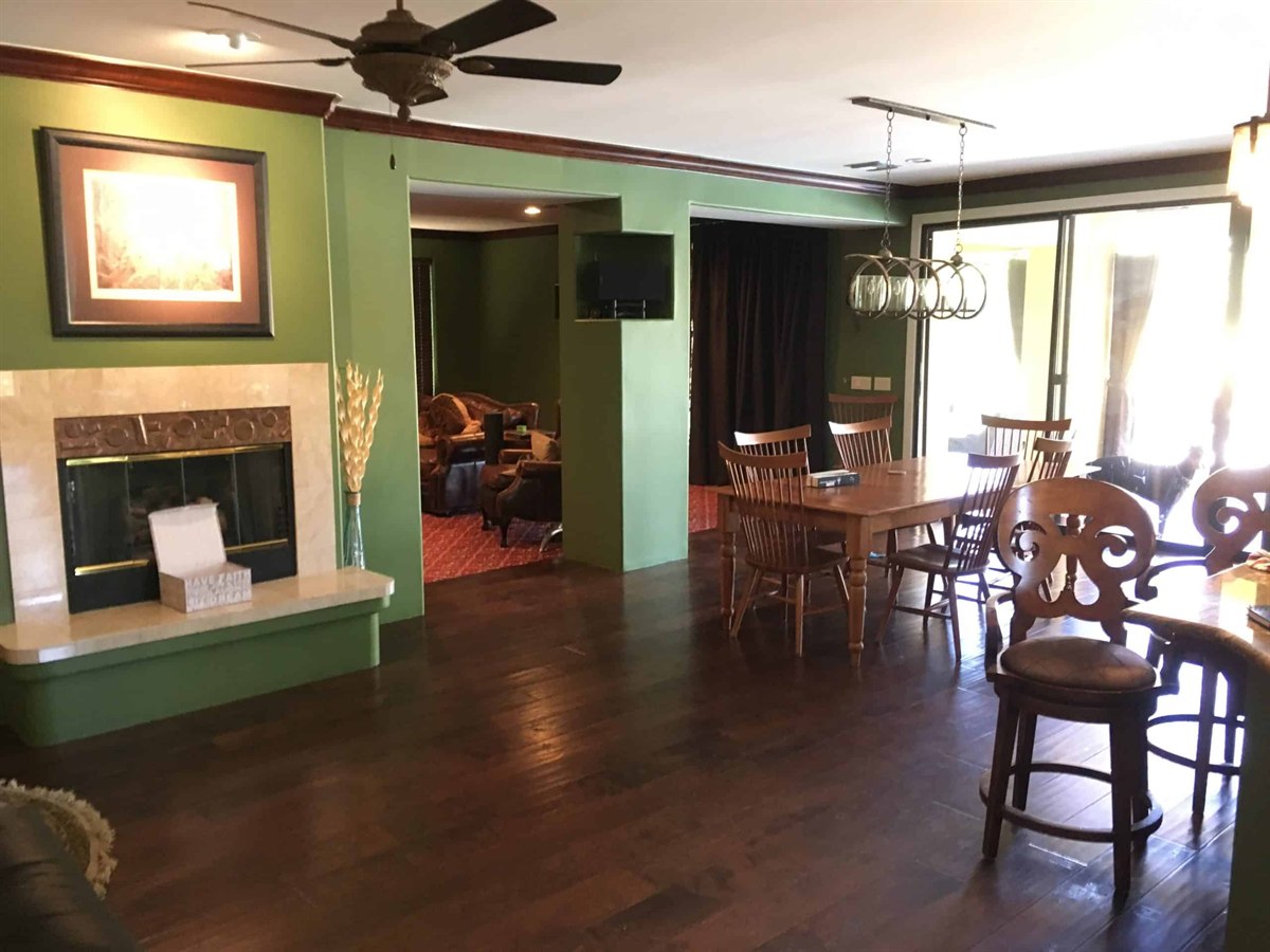 Dining space painted in a coordinated warm color scheme by ACP Painting