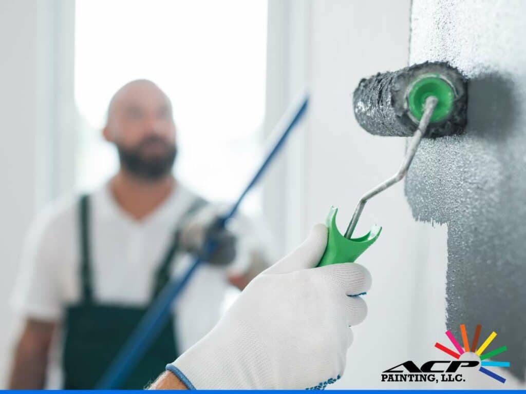 Professional house painting in progress with roller and paint