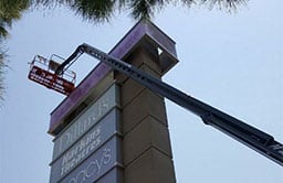 Commercial Painting Services On A Shopping Center Pylon Sign