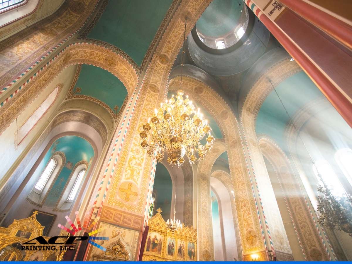 Golden chandelier and arches showcasing vibrant interior church colors in a sacred space.